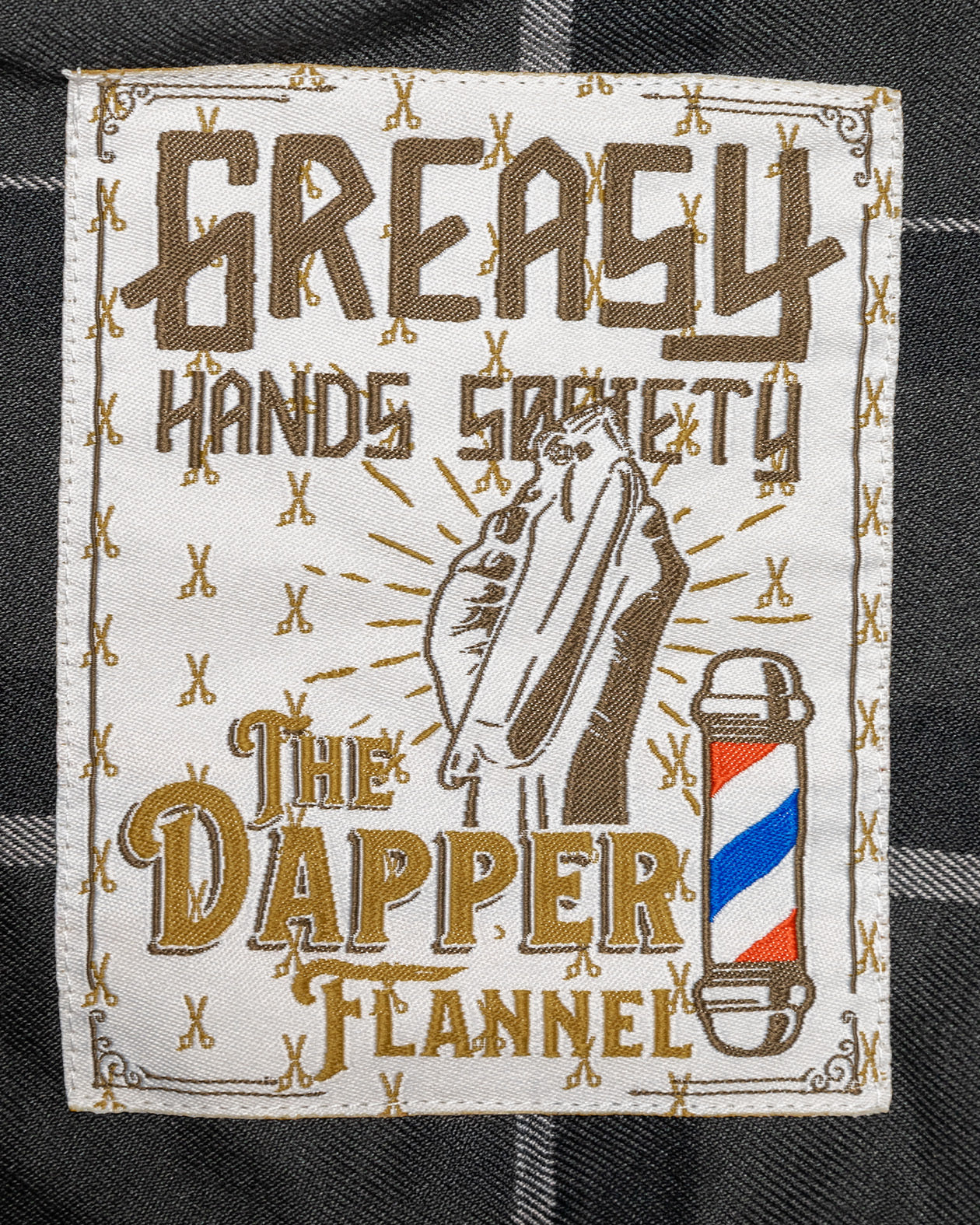 The Dapper Flannel tag art showing a barbers clippers