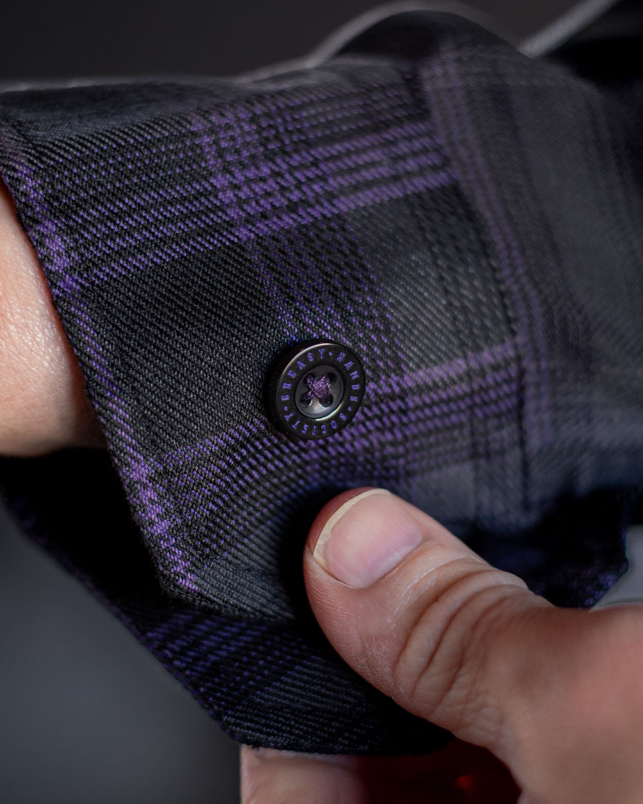 barrel cuff detail on the Kiss the sky purple, gray, and black plaid pattern Flannel 