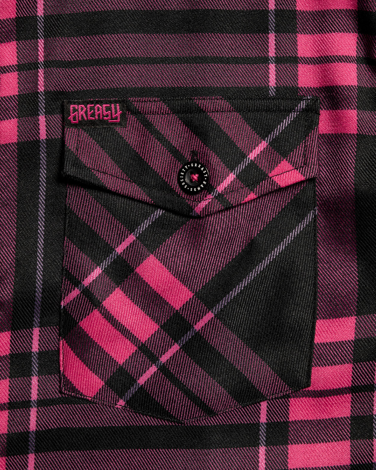 Lonely Heart front pocket in black and pink plaid pattern flannel