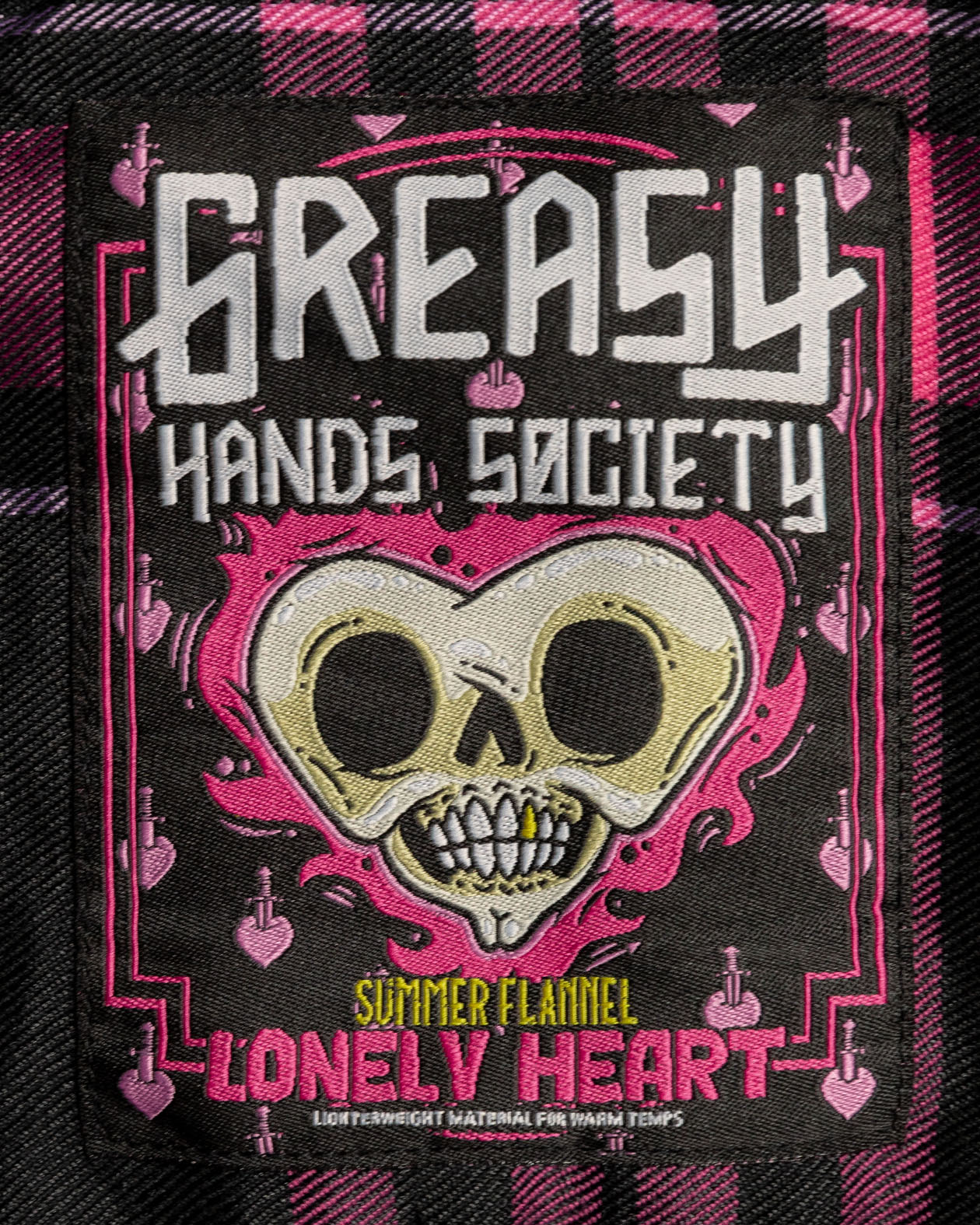 Lonely Heart Flannel tag detail art showing an skull heart