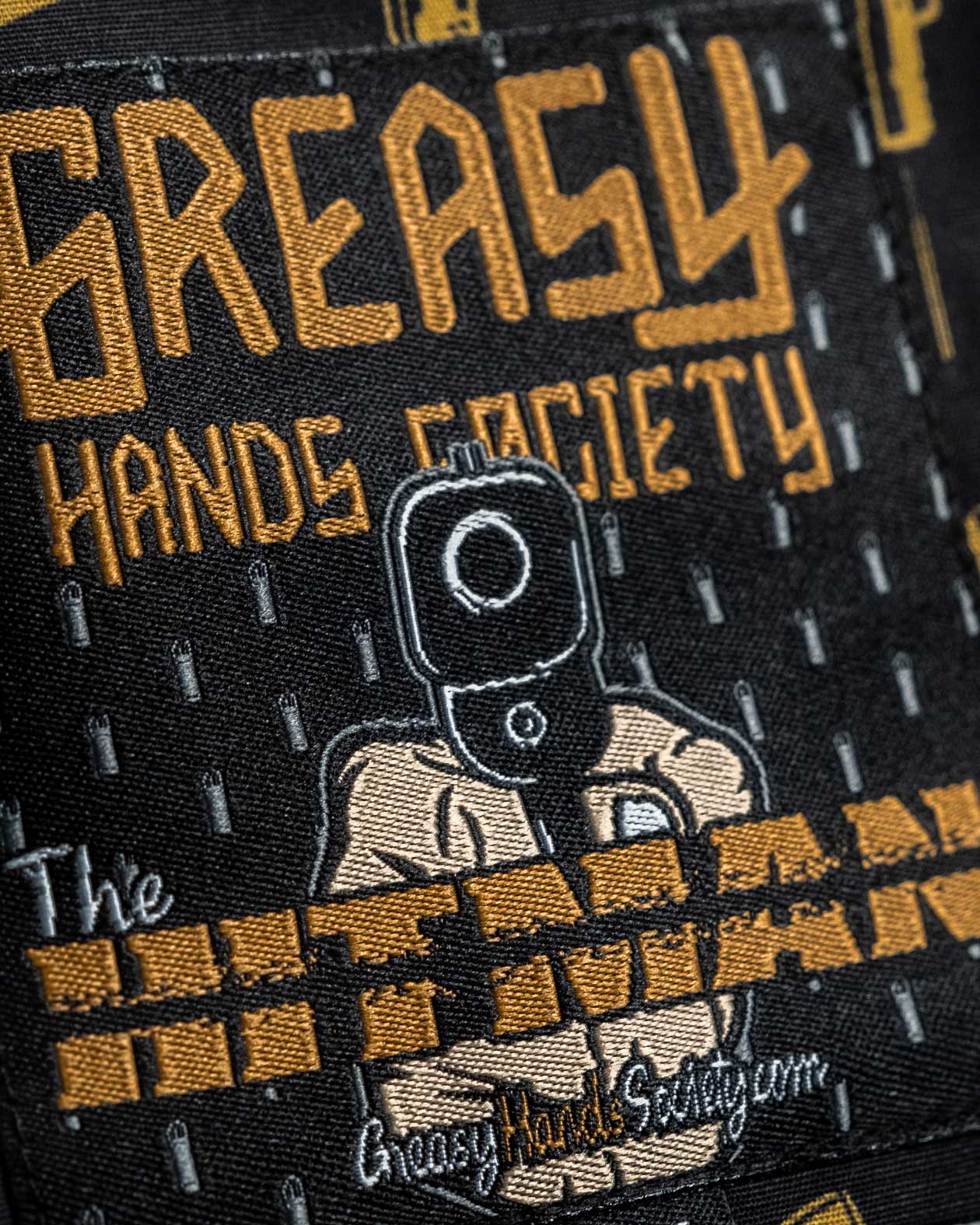 Hitman Button Up Shirt tag art detail showing a hitman's gun