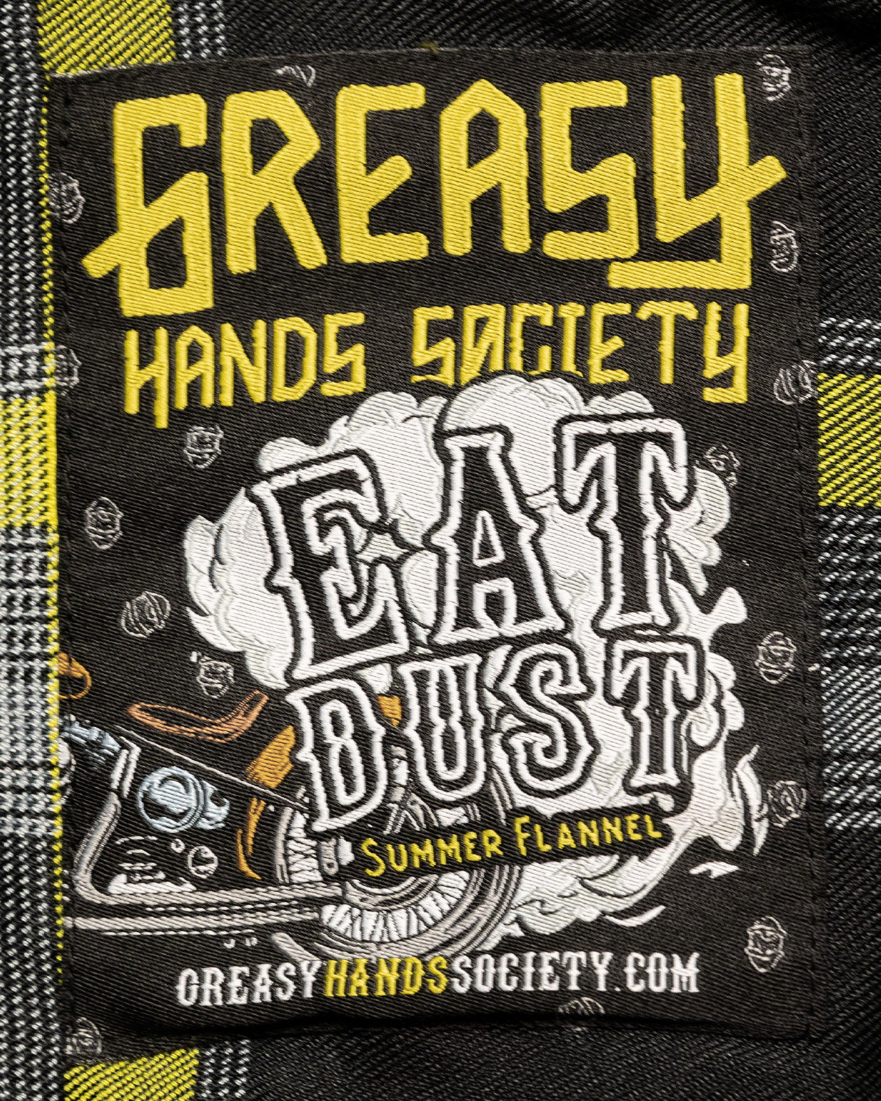 eat dust flannel neck label art showing a motorcycle kicking up dust