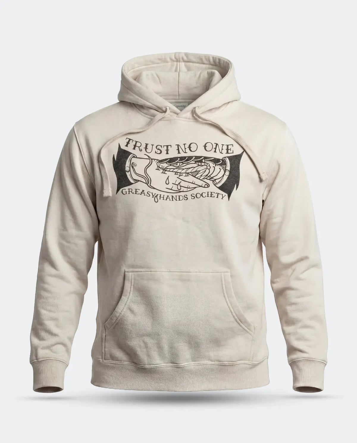 A cream-colored pullover hoodie with a black graphic print on the chest reading 'TRUST NO ONE' and 'GREASY HANDS SOCIETY' around an illustration of a hand holding a dripping scale, shown against a light gray background Trust no One Hoodie by Greasy Hands Society
