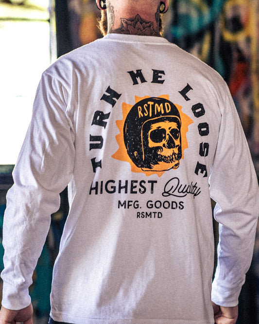 White long-sleeve shirt with graphic design and text on the back, worn by a person - Turn Me Loose long-sleeve graphic tee by Greasy Hands Society