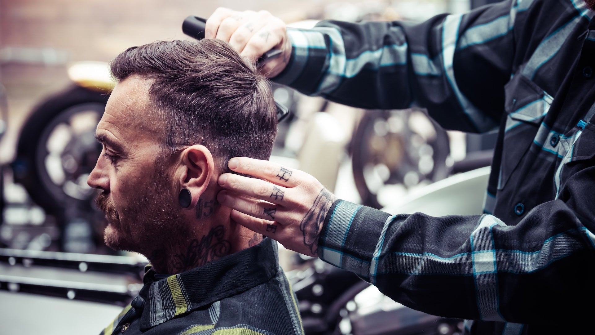 Person getting a haircut with text 'DON'T BE A HEATHEN' displayed.