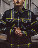 eat dust flannel on a model black yellow and gray flannel