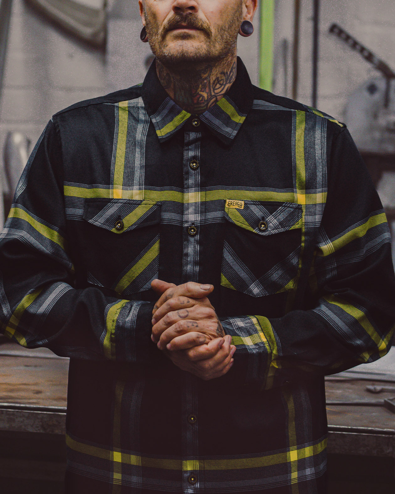 eat dust flannel on a model black yellow and gray flannel