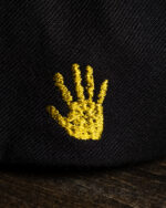 greasy yellow hand hat detail